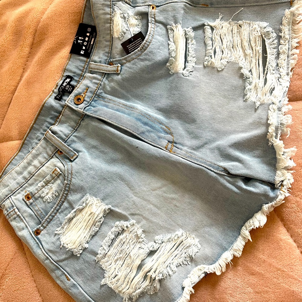Light Blue Wash Distressed Shorts from Fashion Nova